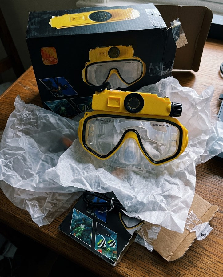 Yellow mask and its box on a table