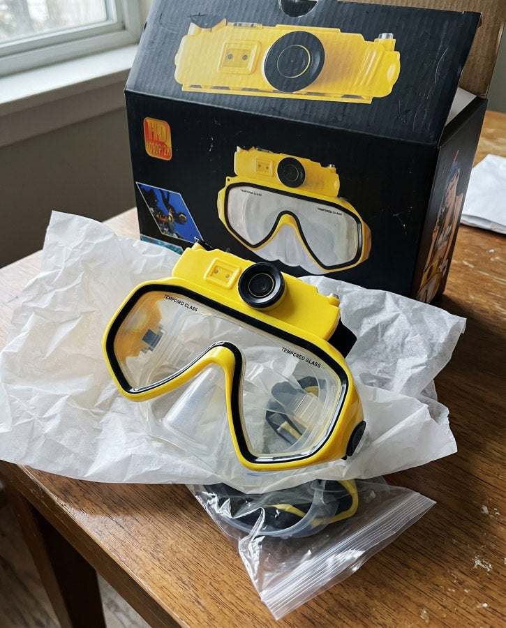 Yellow mask lifted from its box