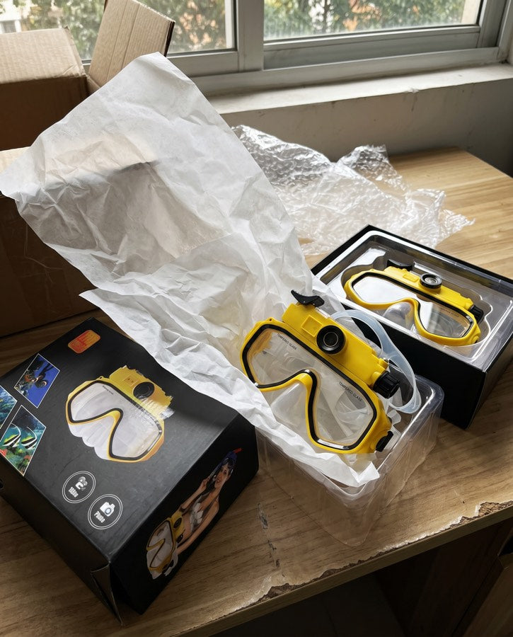 Two yellow masks and boxes by a window
